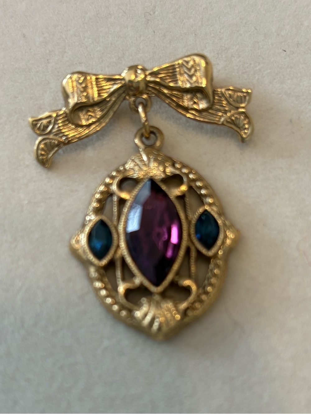 Gold-Tone Bow Pendant Brooch with Purple and Teal Stones